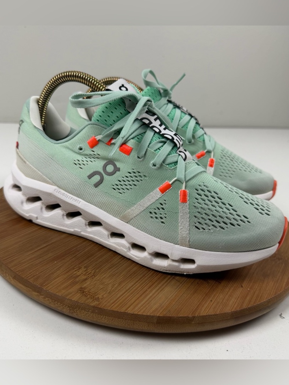 On Running CloudSurfer Mint Green Sneakers with Orange Accents